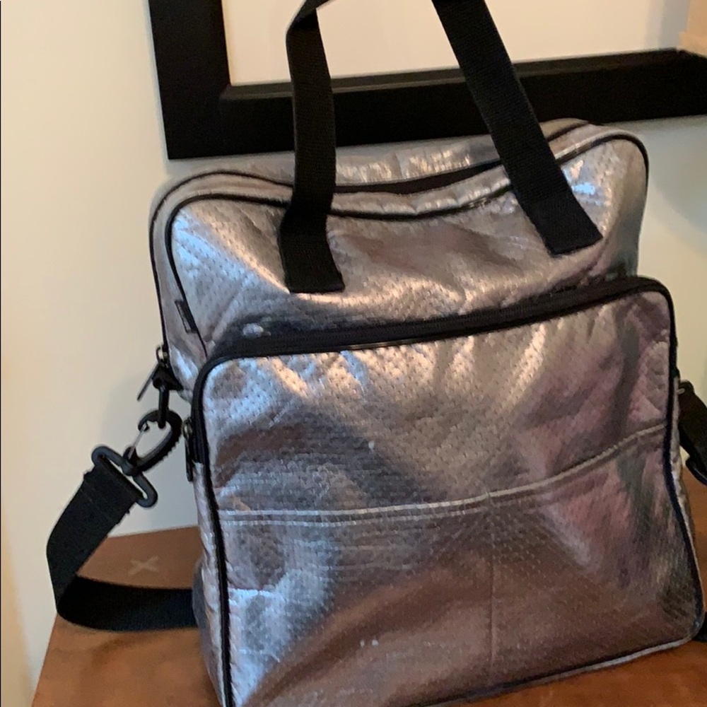 Fun metallic silver travel bag.